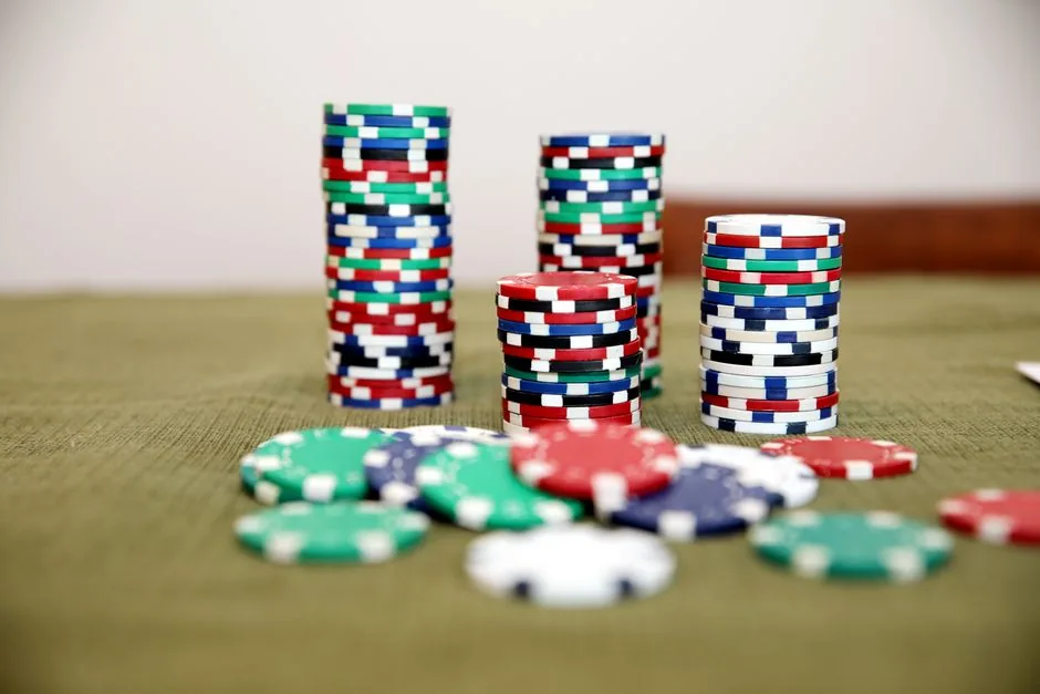 Stacks of poker chips on a green table
