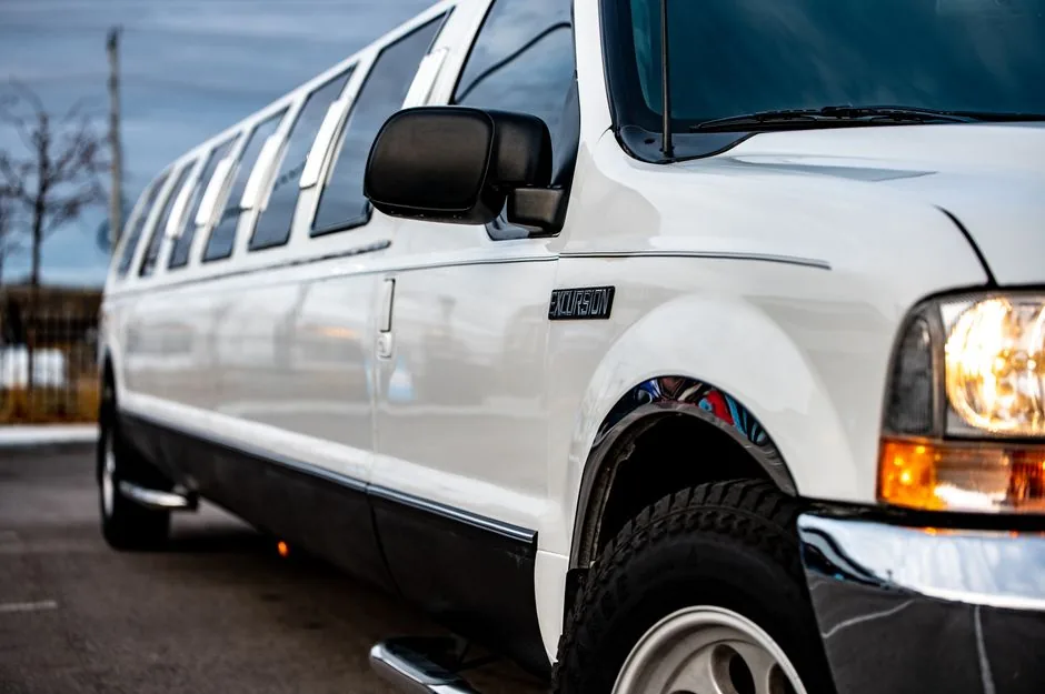 White stretch limousine parked at dusk