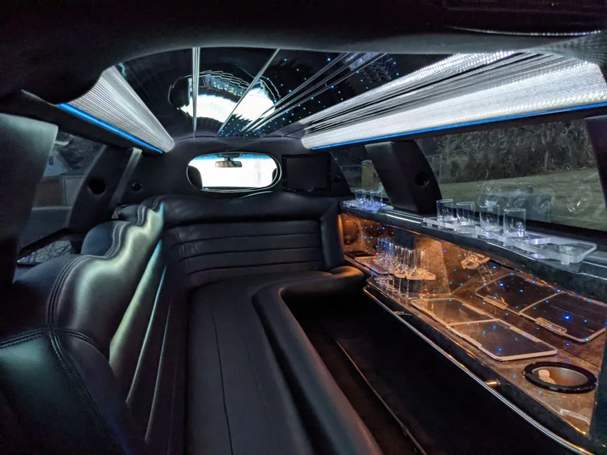 Stretch limousine interior with leather seating and ceiling lights