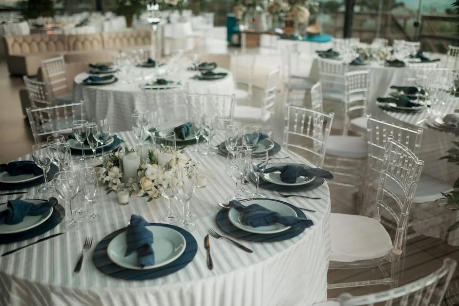 Wedding reception hall set for guests arriving by limousine